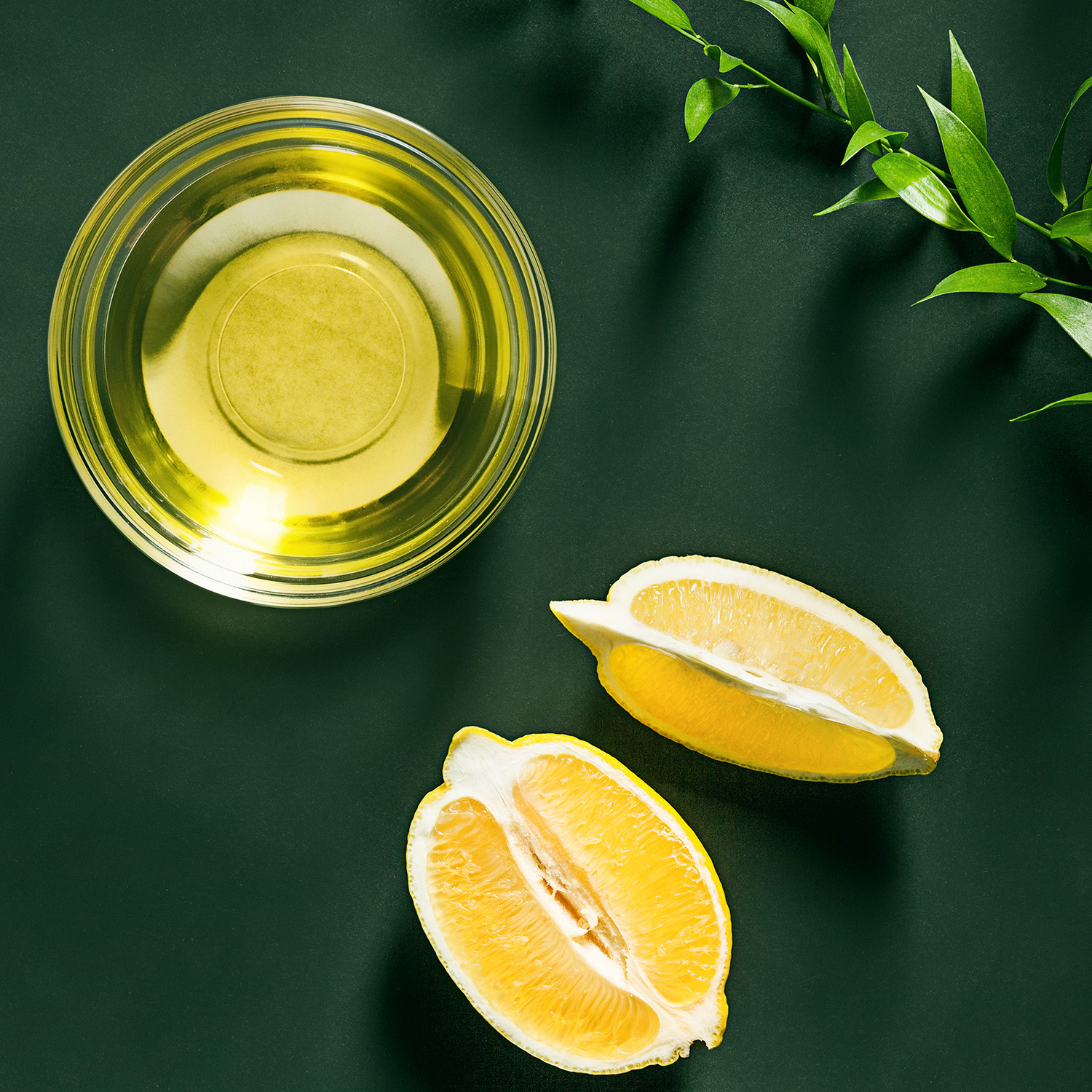 Lemon oil isolated on black table The organic lemon oil on black table